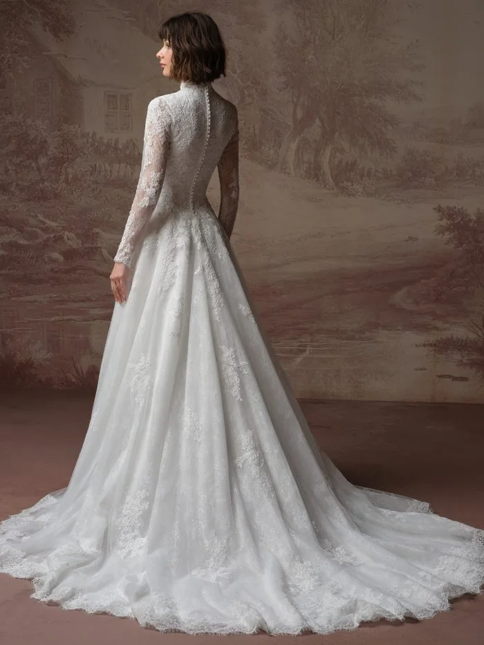Back view of Dominique by Maggie Sottero showcasing a high-neck lace bodice, long illusion sleeves, and covered buttons.