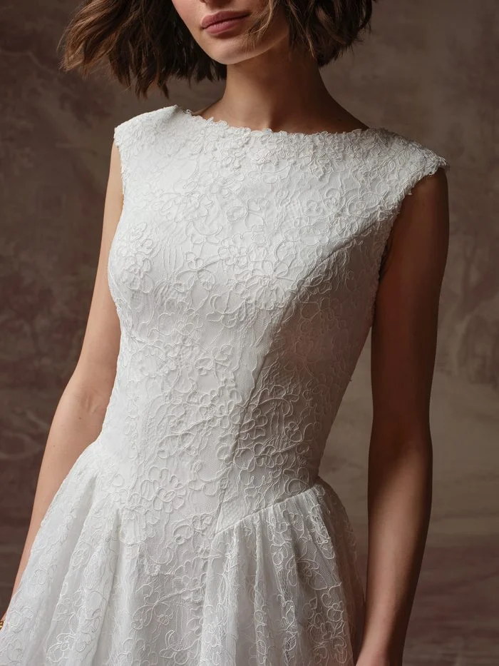 Rebecca Ingram Briar A-line wedding gown with floral lace, a bateau neckline, and a fitted bodice designed to flatter petite brides.