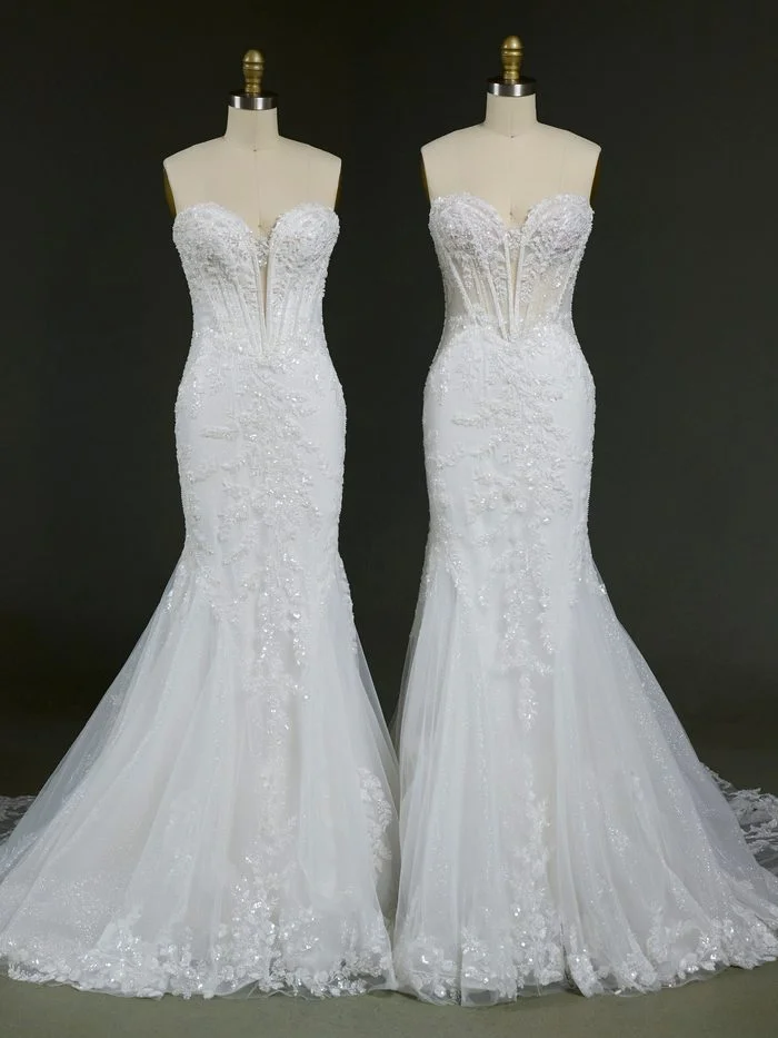 Two versions of the Benjie Royale by Maggie Sottero wedding gown displayed side by side on dress forms. Both feature a fitted mermaid silhouette, a plunging sweetheart neckline, exposed corset boning, and intricate lace appliqués with shimmering beadwork. The gown on the left showcases a more lined bodice for added coverage, while the gown on the right features a sheer corset bodice that highlights the structural boning and lace detailing. Flowing tulle skirts and lace-trimmed hems complete both designs.