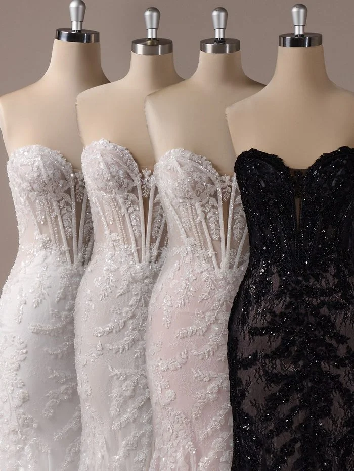 Close-up comparison of four Benjie Royale by Maggie Sottero wedding gown bodices in different colorways. Each version features a sweetheart neckline, sheer corset construction, lace appliqués, and sparkling beadwork. The varying ivory, blush, and black color combinations demonstrate how the gown’s intricate details create different visual effects across available color options.
