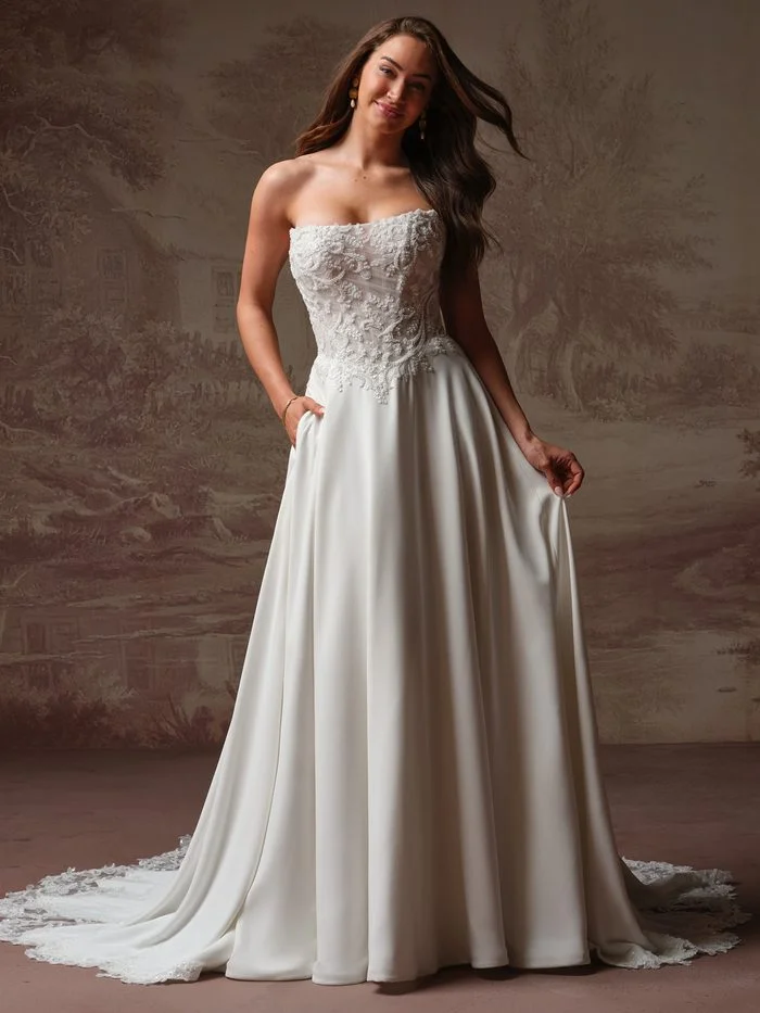 Rebecca Ingram Hazel wedding dress featuring a romantic lace bodice, flattering fitted silhouette, and delicate basque waist.