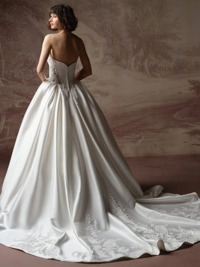 Sottero and Midgley Burke Lane wedding dress featuring a dramatic ballgown silhouette, strapless neckline, and romantic floral detailing.