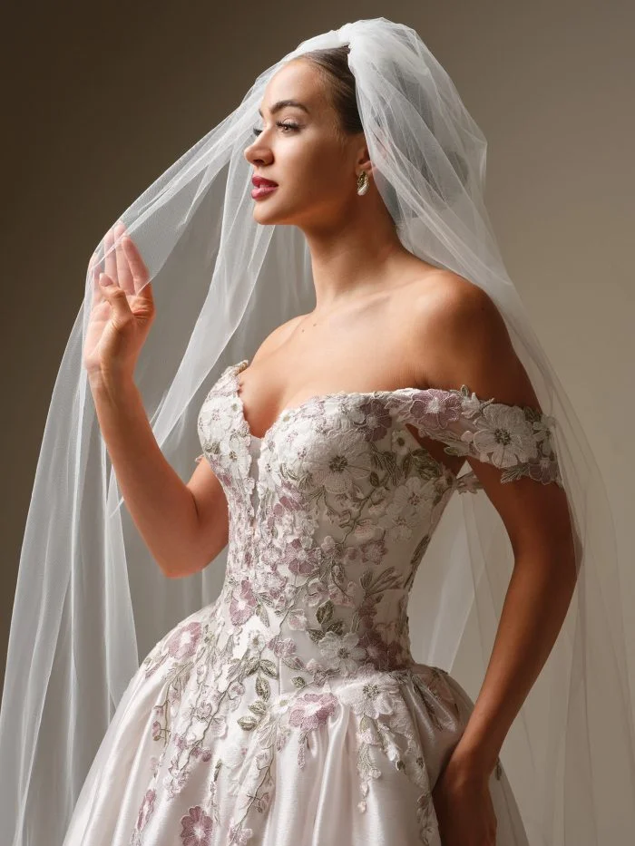 Alvarez by Sottero and Midgley romantic organza ballgown wedding dress with plunging V-neckline and floral lace accents