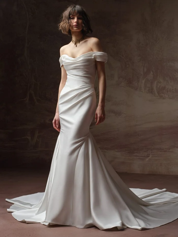 Amaryllis by Sottero and Midgley A-line wedding dress with floral appliqués and a matching veil.