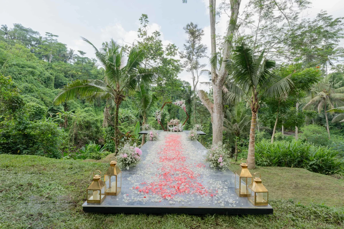 riverside-wedding-ceremony-stage-setup-on-a-cliff-surrounded-by-trees-at-kayumanis-ubud