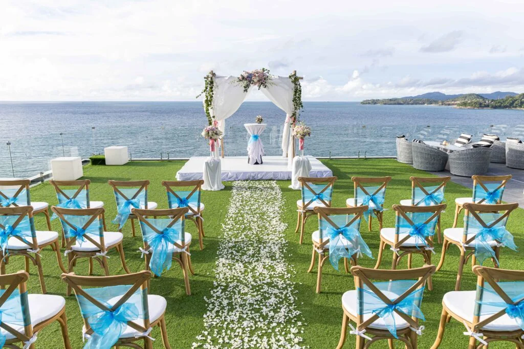 outdoor-rooftop-wedding-ceremony-setup-with-grass-floor-and-views-of-the-ocean-at-cape-sienna-phuket