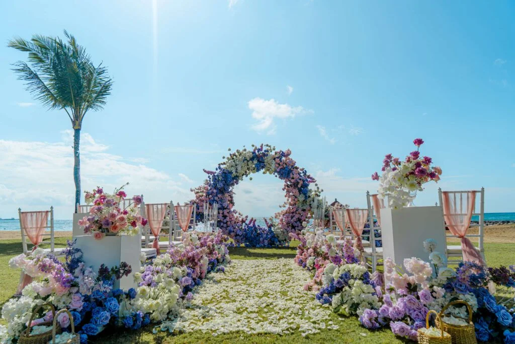 royal-santrian-luxury-beach-villas-bali-weddings-beach-ceremony-setup-with-colorful-flowers