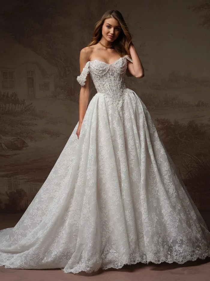 Ryland boho floral ballgown wedding dress with detachable panniers, featuring a beaded lace corset bodice, off-the-shoulder sleeves, and a textured floral lace skirt with dramatic volume for a customizable bridal silhouette.