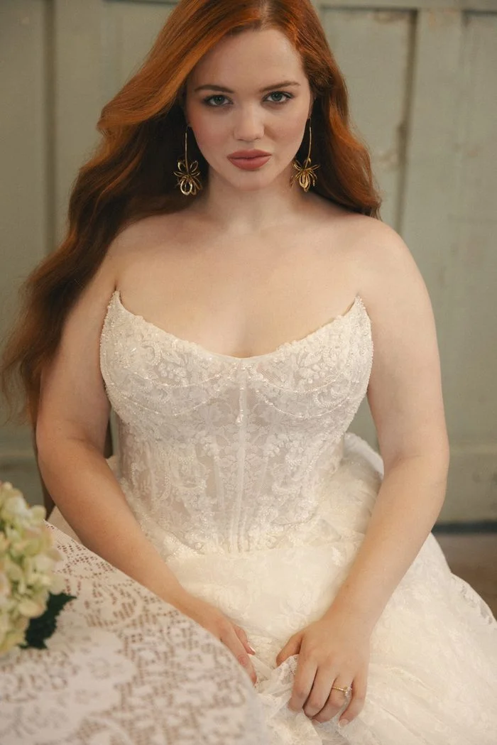 Close-up of the Ryland boho floral wedding dress showcasing a beaded lace corset bodice, sweetheart neckline, and intricate floral lace detailing for a romantic bridal look.