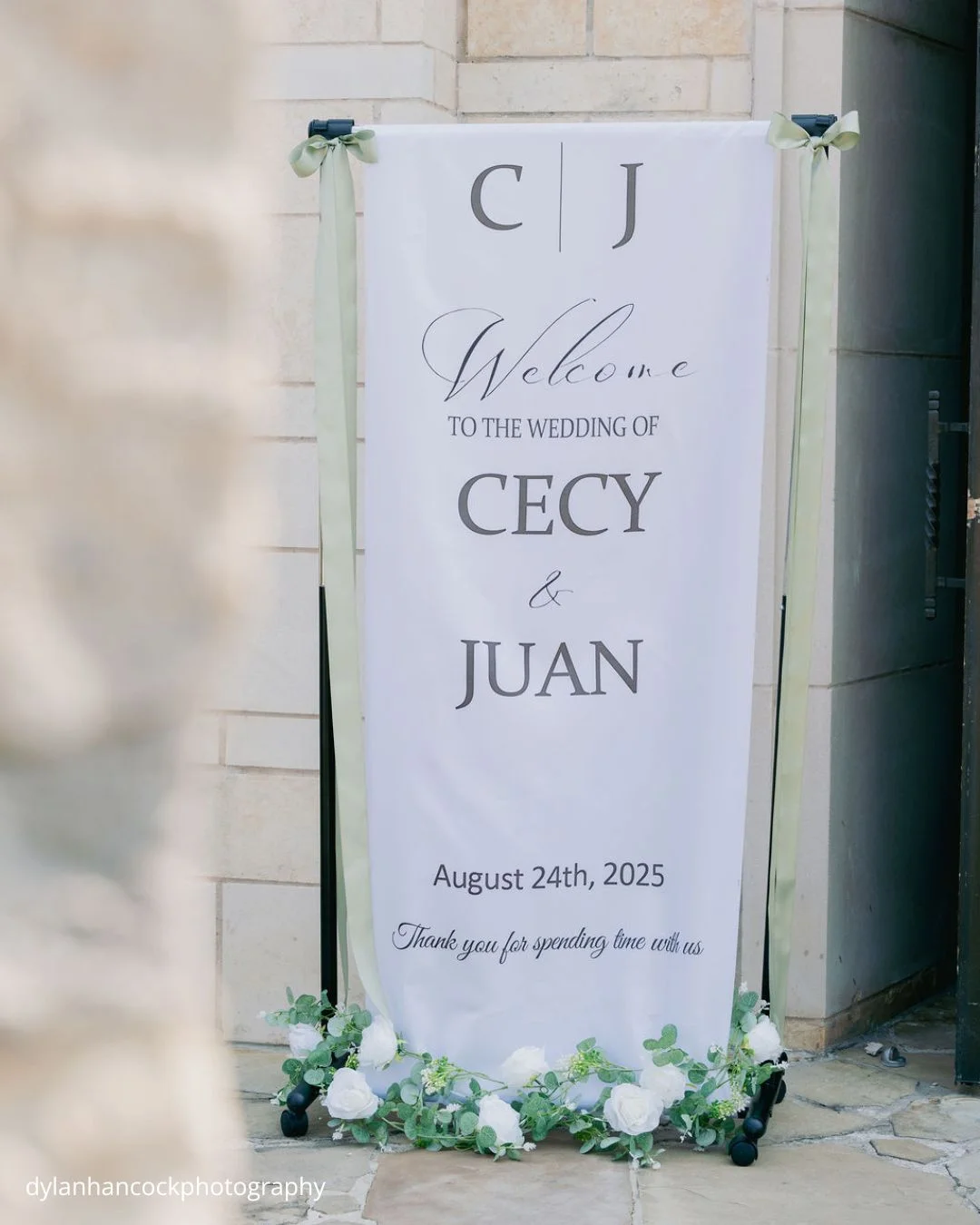 wedding welcome sign with white and green floral decor dylanhancockphotography