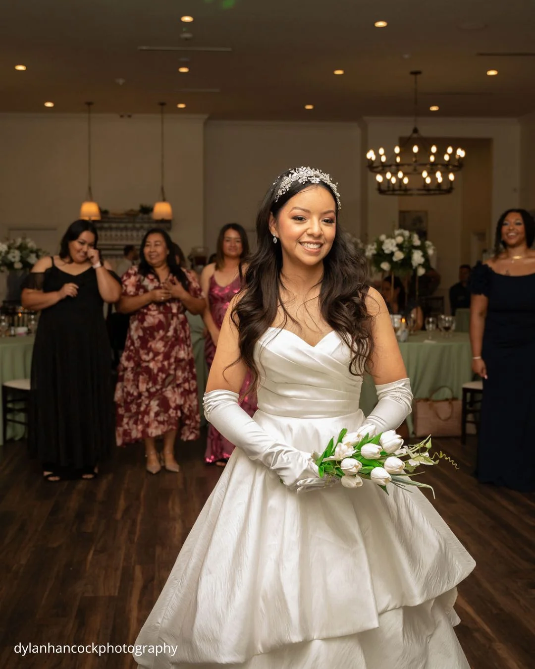 bride prepares to throw bouquet as bridesmaids wait behind dylanhancockphotography