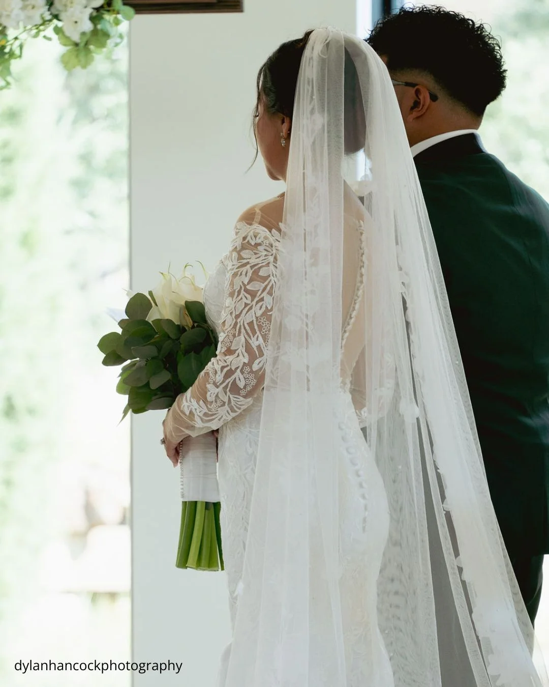 bride and groom standing close gazing at each other during ceremony dylanhancockphotography