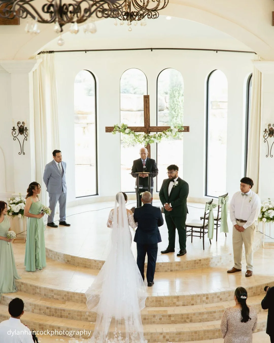 bride walks down the aisle with father as groom waits dylanhancockphotography