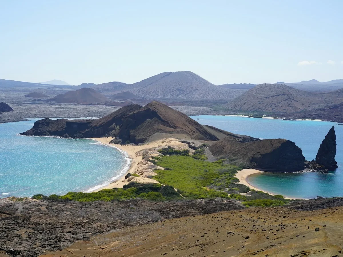 Pinnacle Rock and two curved sandy beaches on Bartolome Island in the Galapagos