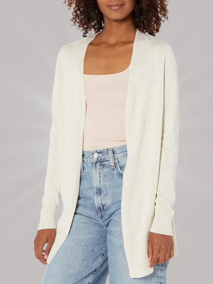 Lightweight cream cardigan paired with a beige tank top and high-waisted light wash jeans.