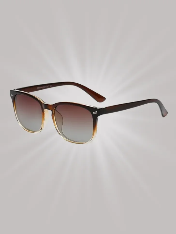 A pair of stylish sunglasses with gradient lenses and a classic frame, perfect for providing both eye protection and a chic look during sunny vacations or beach outings.
