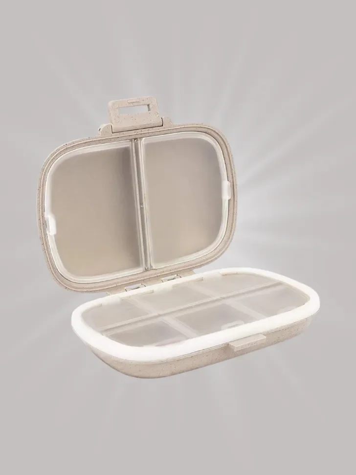 A compact and divided travel case with an easy-to-open lid, ideal for organizing small items like pills or jewelry while on the go.