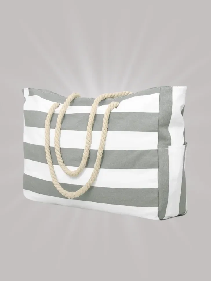 Striped beach tote with rope handles and side pocket.
